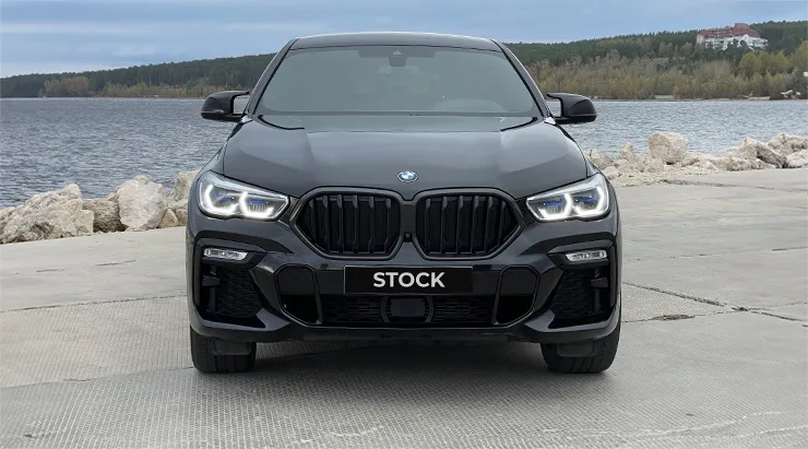 Front view on a BMW X6 with a body kit giving the car a custom appearance