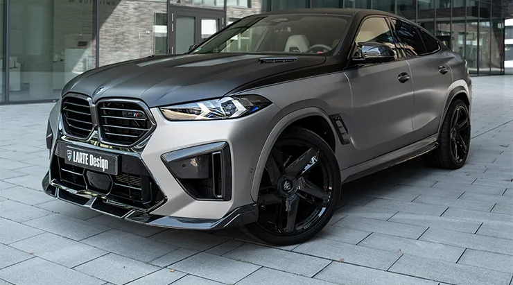 Front angle view on a BMW X6M F96 LCI Restyling with a body kit giving the car a custom appearance