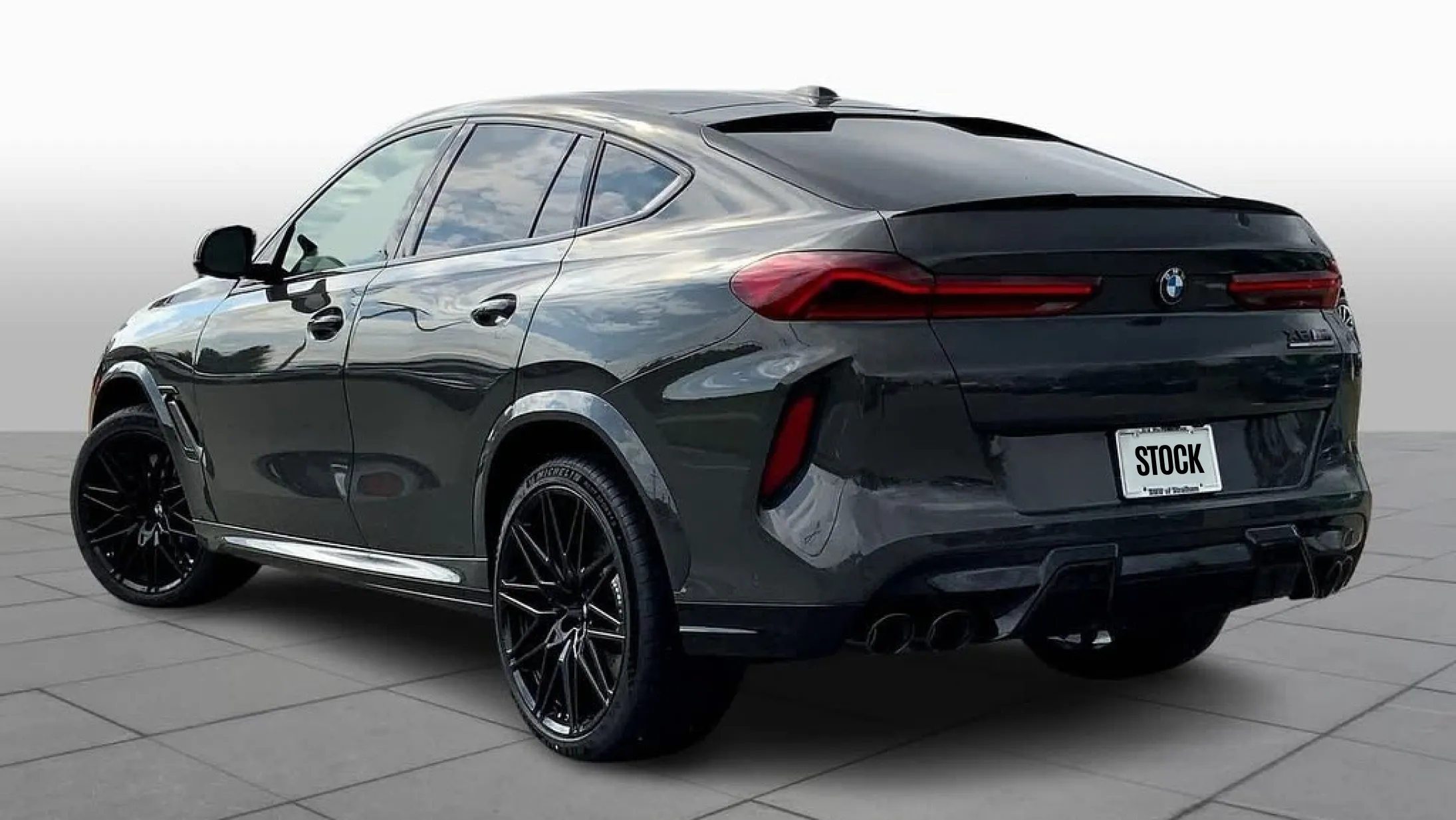 Rear angle view on a BMW X6M F96 LCI Restyling with a body kit giving the car a custom appearance