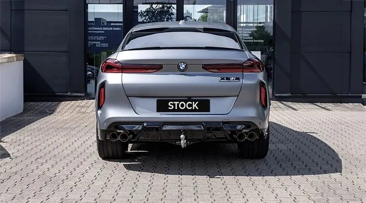 Rear view on a BMW X6M F96 LCI Restyling with a body kit giving the car a custom appearance