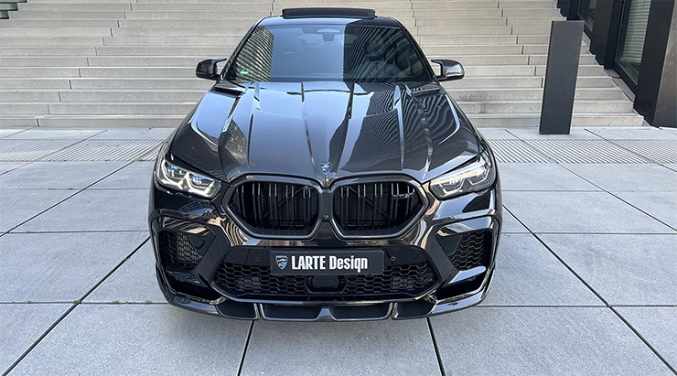 Front view on a BMW X6M with a body kit giving the car a custom appearance