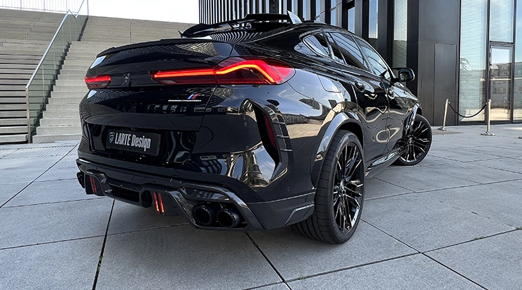 Rear angle view on a BMW X6M with a body kit giving the car a custom appearance