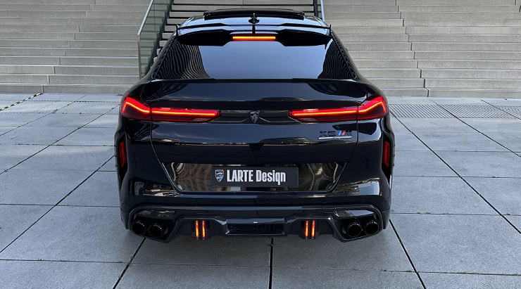 Rear view on a BMW X6M with a body kit giving the car a custom appearance