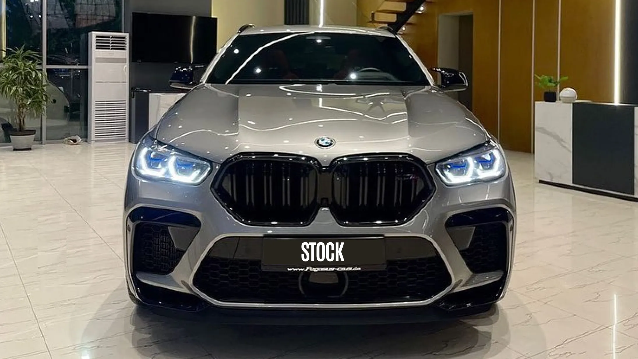 Front view on a BMW X6M with a body kit giving the car a custom appearance