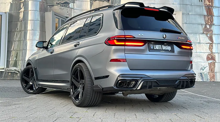 Rear angle view on a BMW X7 with a body kit giving the car a custom appearance