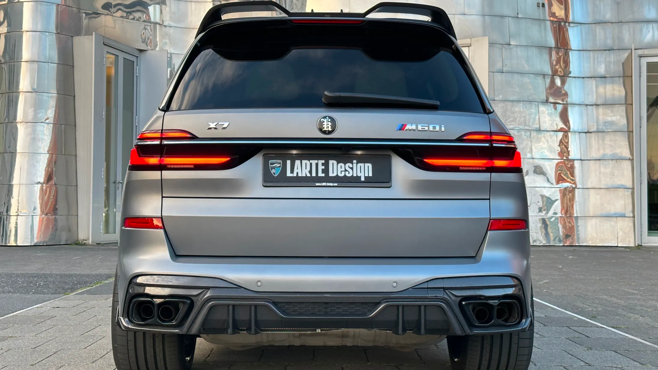 Rear view on a BMW X7 with a body kit giving the car a custom appearance