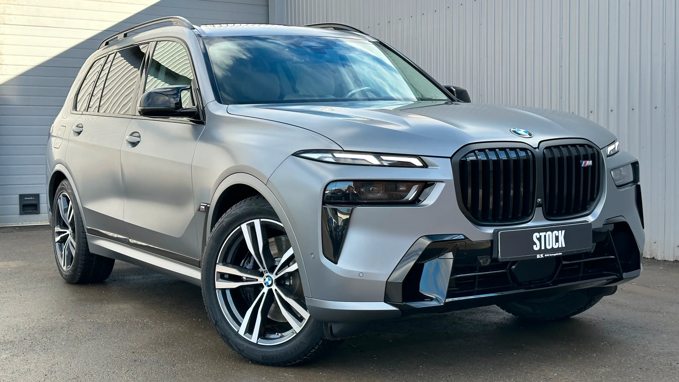 Front angle view on a BMW X7 with a body kit giving the car a custom appearance