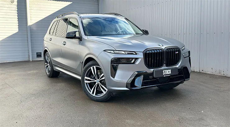 Front angle view on a BMW X7 with a body kit giving the car a custom appearance