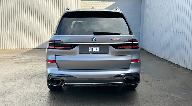 Rear view on a BMW X7 with a body kit giving the car a custom appearance