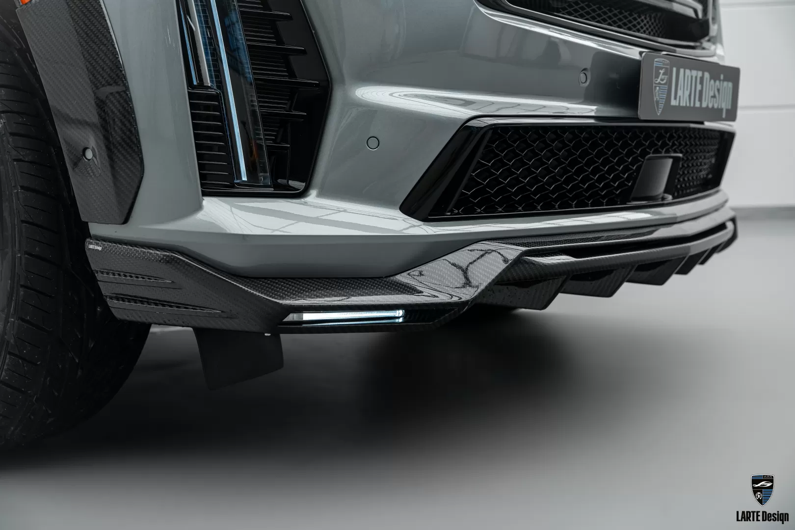 Carbon fiber front bumper overlay with LED running lights for Cadillac Escalade-V / V-ESV