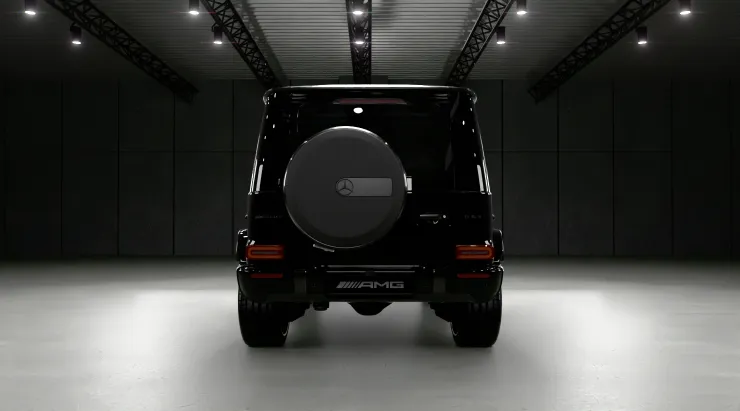 Rear view on a MERCEDES G 63 W463A FACELIFT 2024 - 2026 WIDEBODY with a body kit giving the car a custom appearance
