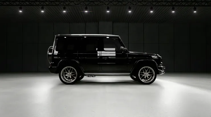 Side view on a MERCEDES G 63 W463A FACELIFT 2024 - 2026 WIDEBODY with a body kit giving the car a custom appearance