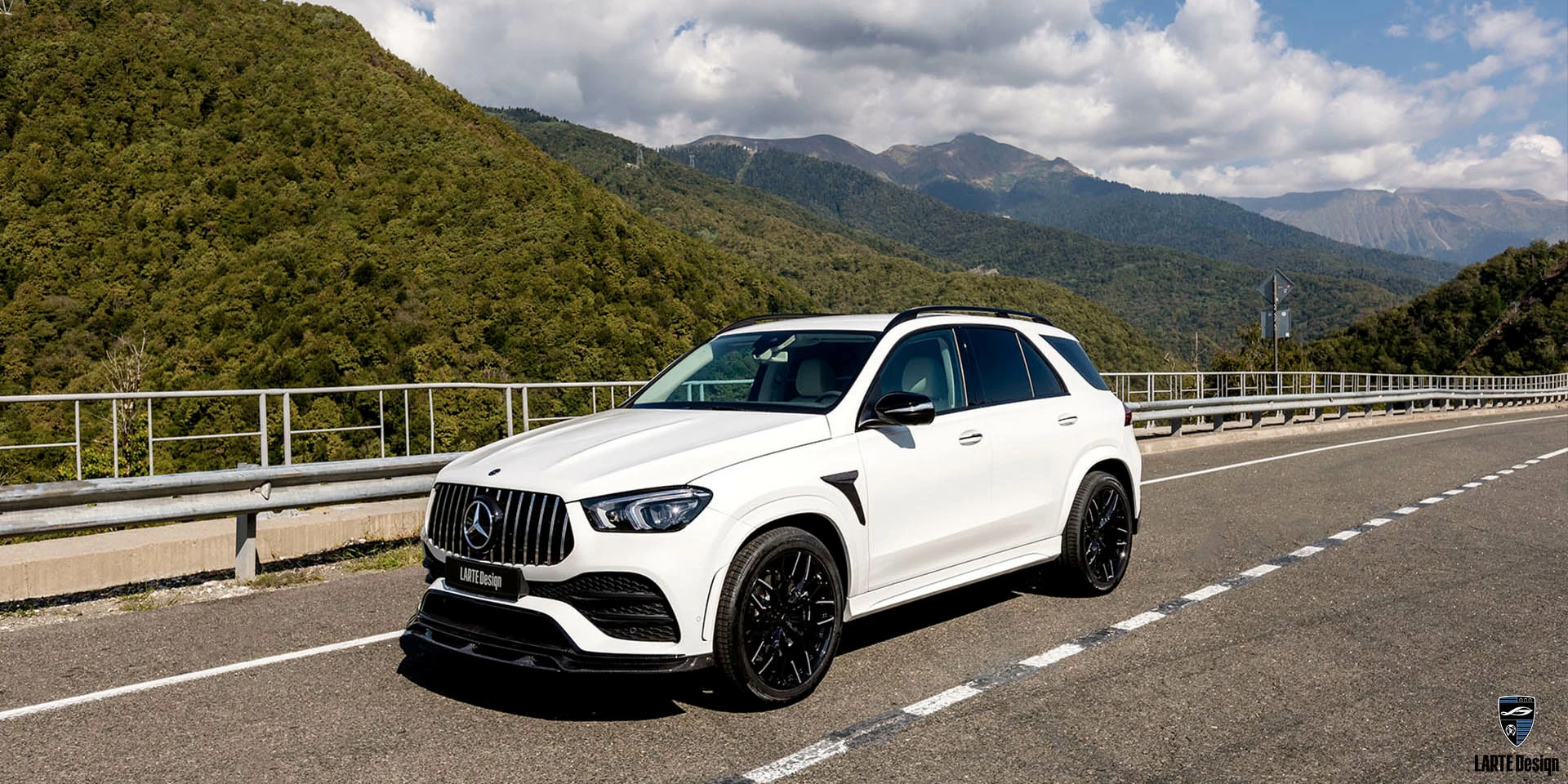 Mercedes-Benz GLE at carbon fiber Winner body kit on the background of the mountains