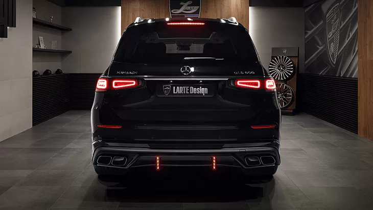 Rear view on a Mercedes Maybach GLS 600 with a body kit giving the car a custom appearance
