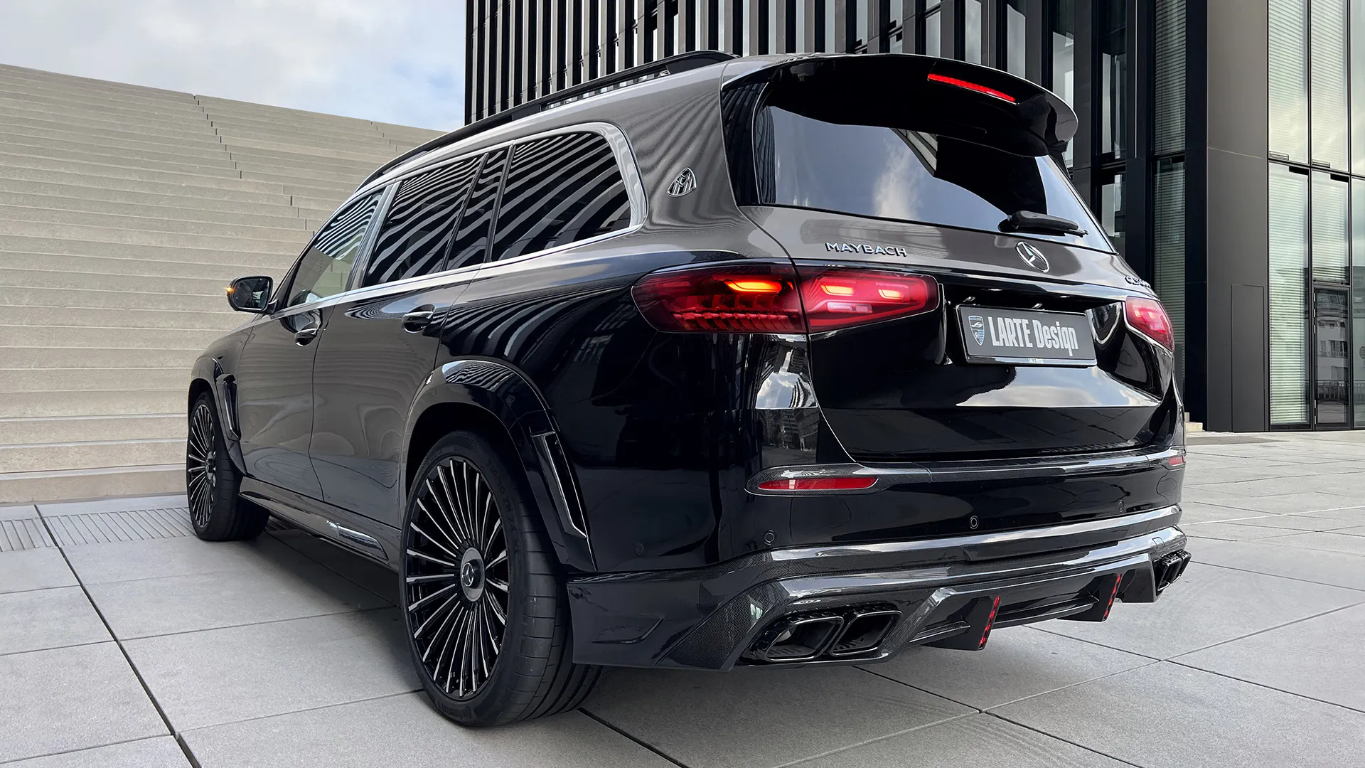 Rear angle view on a Mercedes Maybach GLS 600 Facelift 2025 with a body kit giving the car a custom appearance