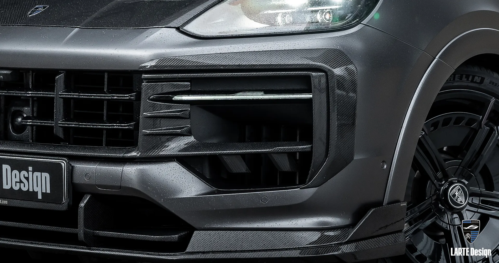 Sporty look with carbon front bumper overlays upgrades designed for Porsche Cayenne by Larte Design.