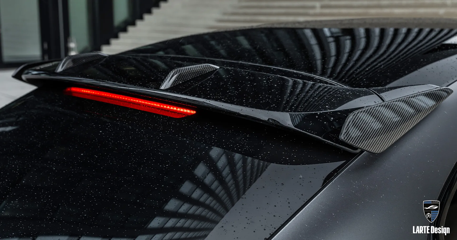 Aerodynamic Cayenne roof spoiler overlays, enhancing performance and luxury car appearance.