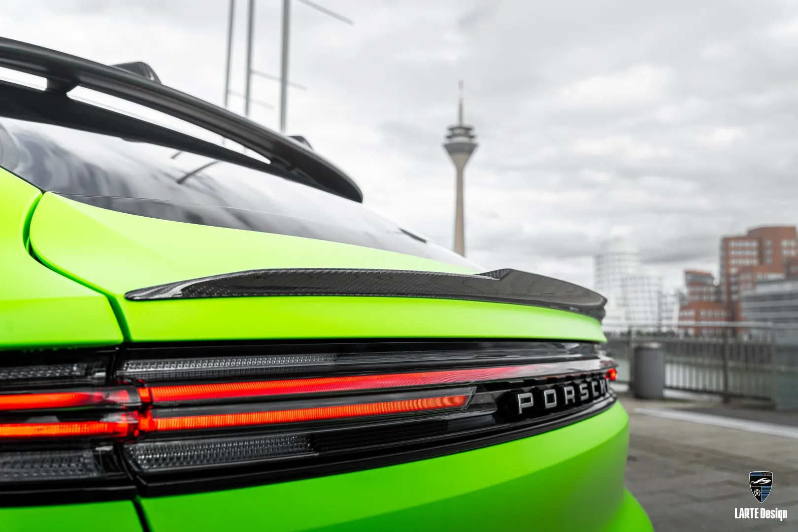 Porsche Cayenne Rear Mid Trunk Spoiler by Larte Design enhances the vehicle's sporty profile.