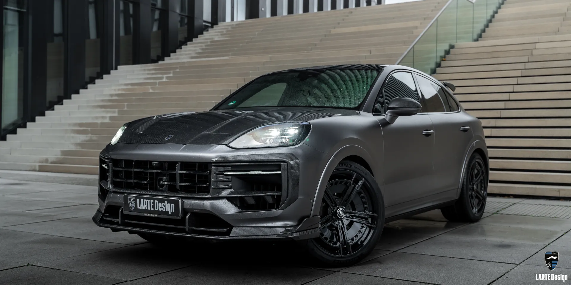 Carbon fiber splitter for luxury car Porsche Cayenne S Coupe offering aggressive styling.