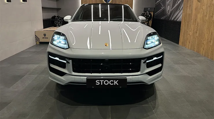 Front view on a Porsche Cayenne S Coupe with a body kit giving the car a custom appearance