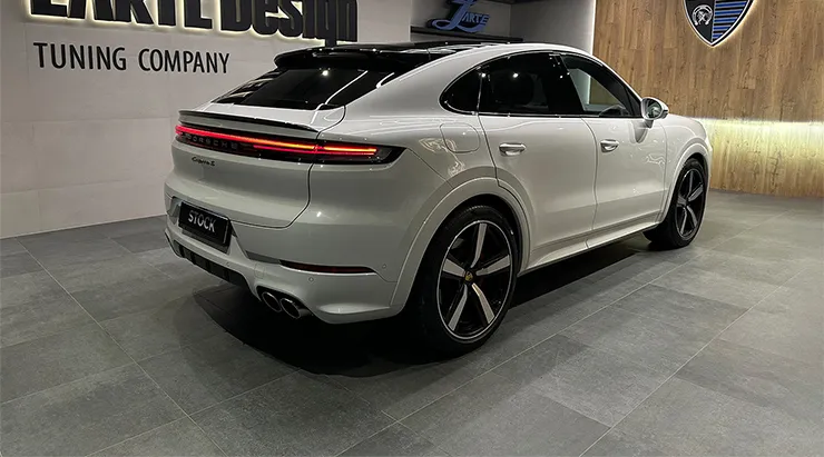 Rear angle view on a Porsche Cayenne S Coupe with a body kit giving the car a custom appearance