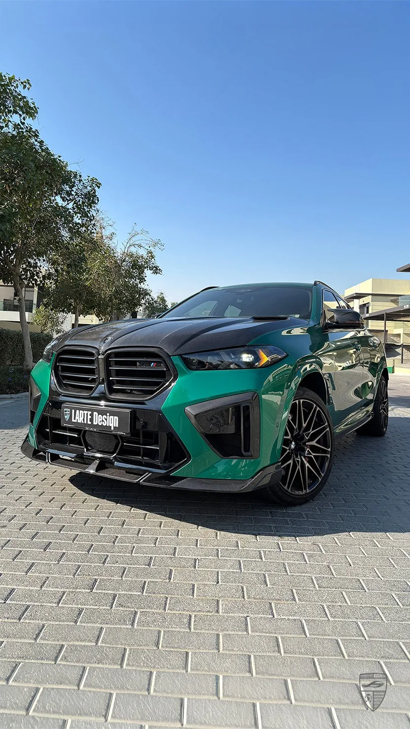 Green BMW X6M Competition front view with carbon fiber body kit by Larte Design