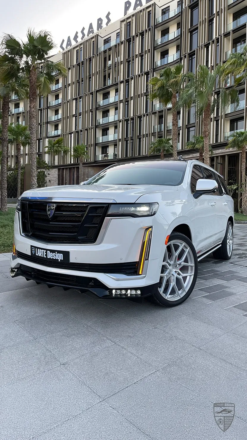 White Cadillac Escalade luxury SUV with custom exterior styling